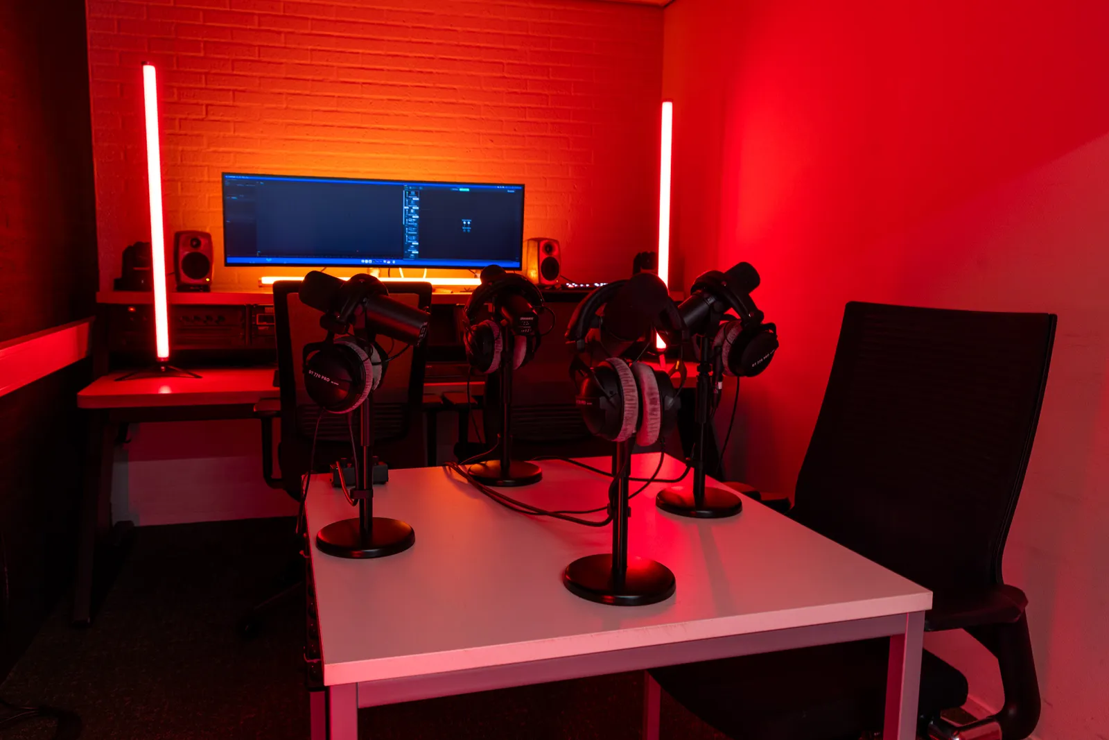 Edit bay desk with wall-mounted microphone